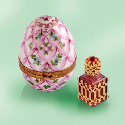 Picture of Limoges Pink Trellis Egg with Roses  and BLue Flowers Box with Burgundy and Gold Perfume Bottle.